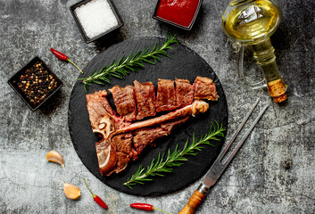 Grilled T-bone steak on stone background