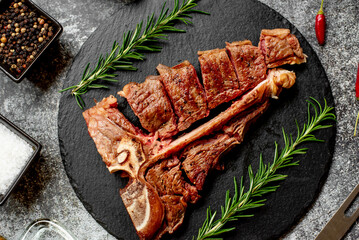 Grilled T-bone steak on stone background