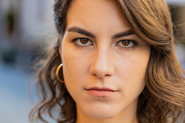 Close-up portrait sad unhappy woman thinks over life concerns, suffers from unfair situation....