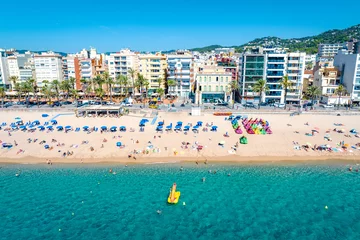 Fototapeten Resort town on the Mediterranean coast in Spain. Drone view of the main beach in the town Lloret de Mar, Girona  Spain  © Andreas May