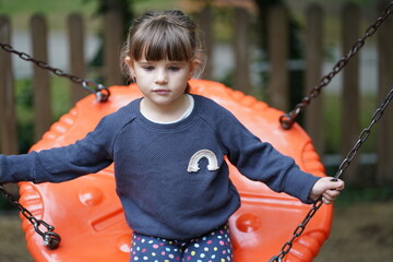 child on the playground in varna bulgaria sea garden - obrazy, fototapety, plakaty