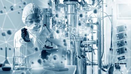 Scientist biologist with microscope. Woman near bioreactor. Science microbiology. Scientist at...