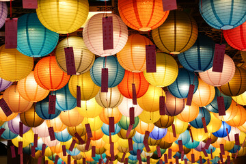 Fototapeta premium There were many large, round, multi-colored lamps on the ceiling.