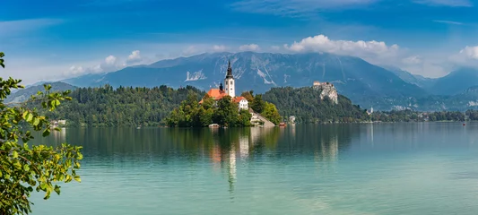 Deurstickers Lake Bled (Blejsko jezero) Slovenia. Beautiful mountain lake with small Pilgrimage Church. Most famous Slovenian lake and island Bled with Pilgrimage Church of the Assumption of Maria and Bled Castle  © majonit