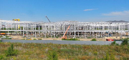 Work site and large steel frame of a large commercial building. Construction site. Metal frame. Ust-Kamenogorsk (kazakhstan)