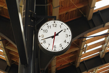 Train station clock. Vintage retro style round clock. Wooden roof platform. Train departure...