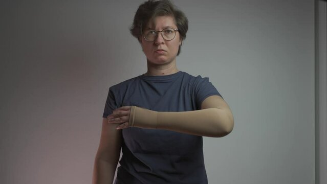 Medical hand compression stockings for treatment of varicose veins, thrombosis and thrombophlebitis. Compressive knitwear. Hospital compression sock on hand. Hand support for lymphedema, arthritis. 