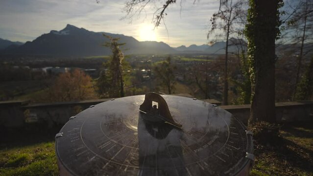 Mountain view from monchsberg hill from pointer or compass at sunset in sunny winter weather, Salzburg, Austria. Josefsturm. Bertoldsturm, Stadttor. Bertolds Zwinger. Mittelalter. Directional signpost