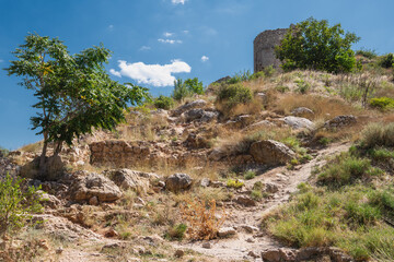 Fototapeta na wymiar Hill with fragments of the ruins of an ancient fortress.