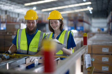 Warehouse staff verify automotive, paper items using handheld device, ensuring precise shipment.