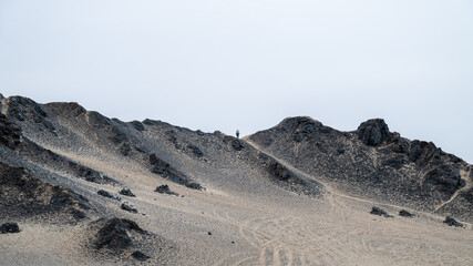 A man standing on the mountain peak