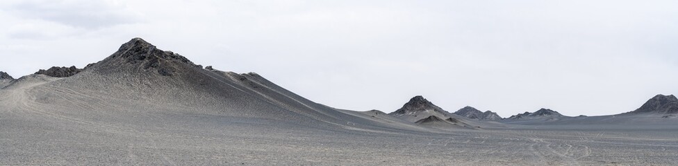 landforms of black mountain peaks which are like moon surfaces. Panorama photo.