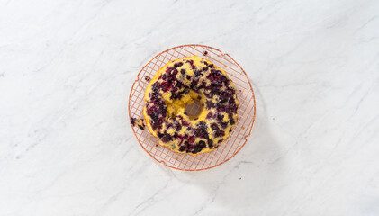 Obraz na płótnie Canvas Lemon blueberry bundt cake with powdered sugar dusting