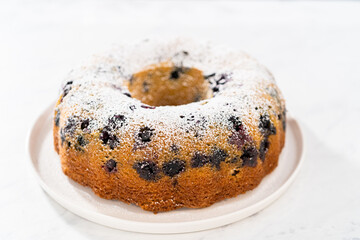 Lemon blueberry bundt cake with powdered sugar dusting