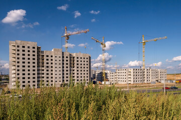 tower cranes working on construction