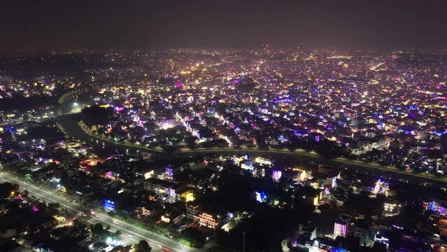 aerial drone hyperlapse shot showing indian city jaipur delhi gurgaon rajasthan during diwali makar sankranti with fireworks shooting up and colorful lights on houses