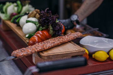 Luxury food in the restaurant. Barbecue,Grilled skewers on the grill. Grilled skewers on fireSalad on the table to serve. Dish on the table. Luxury food in the restaurant,