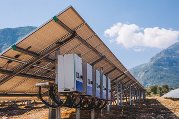 Solar panels on a mountain. A view of the solar panel with the mountains in the background,Solar...
