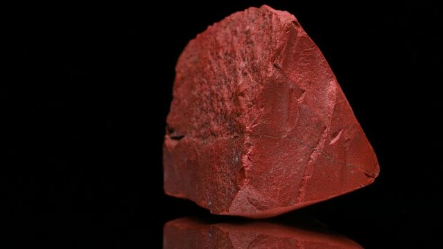 Red Jasper (opaque cryptocrystaline quartz) sample rotating slowly against a black background.