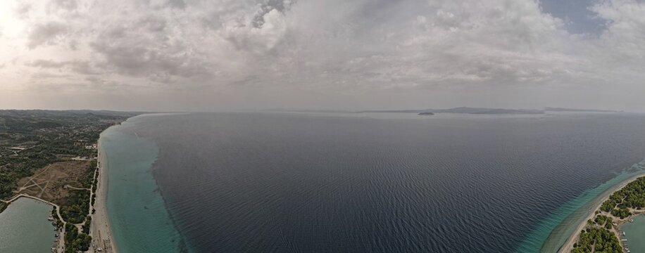 Overhead drone photo over the rocks and the tropical blue ocean of Paliouri n Halkidiki, Greece