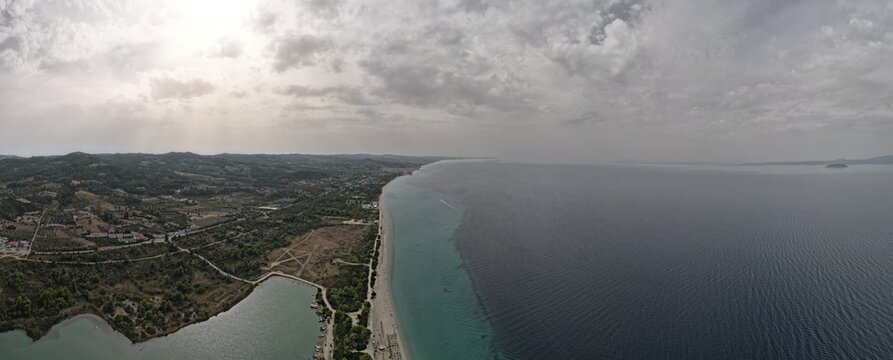 Overhead drone photo over the rocks and the tropical blue ocean of Paliouri n Halkidiki, Greece