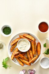 Oven baked potato wedges with sauce