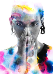 A colorful paintography portrait of a young man holding hands together