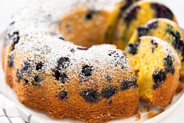 Lemon blueberry bundt cake with powdered sugar dusting