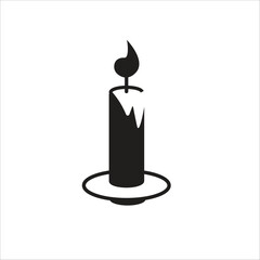 a black and white picture of a candle on a plate
