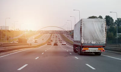 Foto op Aluminium A truck on the intercity highway motorway with three lanes © Andriy Sharpilo