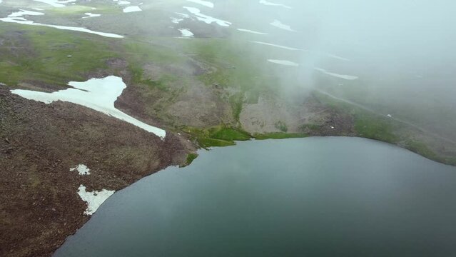Aerial drone shot of Kari Lake, capturing its tranquil waters and the surrounding scenic beauty from a breathtaking perspective