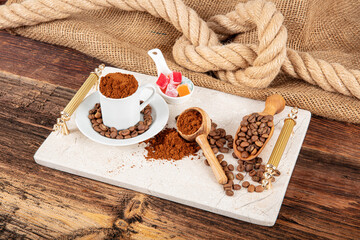 Ground coffee. Roasted coffee beans, ground coffee and instant coffee in bowls at dark background.