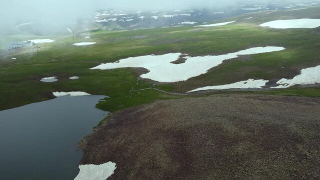 Aerial drone shot of Kari Lake, capturing its tranquil waters and the surrounding scenic beauty from a breathtaking perspective