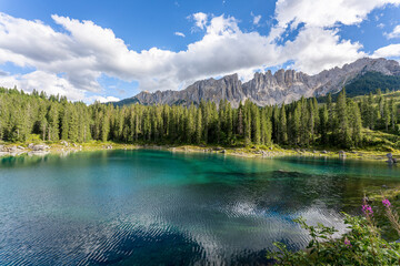Carezza lake on a sunny day, Italy. - 655327590