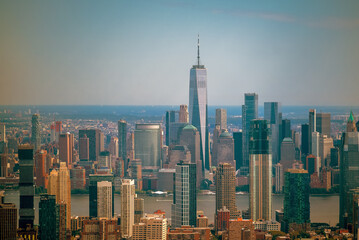 Aerial cityscape about The New york city's skyscrapers. Lower Manhattan business distict with One world trade center. Brooklyn is on the background with East river, Manhattan and Brooklyn bridges.