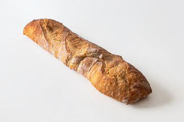 Rustic wheat flour baguette on a white background
