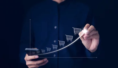 Foto op Canvas Online sale business growth concept. Businessman drawing increasing trend graph of sale volume with bigger shopping trolley cart. long term investment growth goal, Digital Marketing Strategies, © Supatman