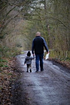 boy and man walking 