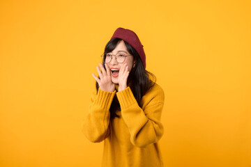 Announce in style! A chic woman, wearing a red beret and yellow sweater, raises her voice against a...