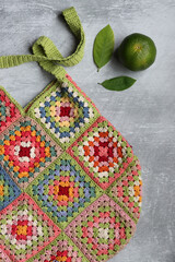 Colorful shopper bag made of organic cotton. Crochet texture close up photo. Environment friendly...