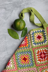 Colorful shopper bag made of organic cotton. Crochet texture close up photo. Environment friendly...