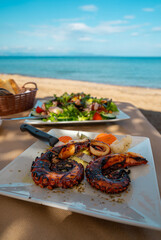 Grilled octopus tentacles and salad with mussels. - obrazy, fototapety, plakaty
