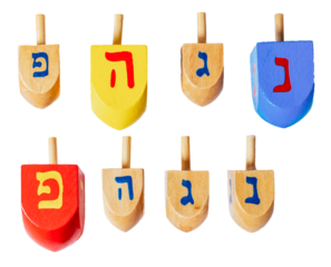 Wooden dreidels for Hanukkah isolated on white or transparent background.