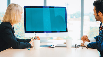 Business people in the conference room with green screen chroma key TV or computer on the office...