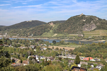Fototapeta na wymiar city in valley at river and mountains