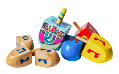 Wooden dreidels for Hanukkah isolated on white or transparent background.
