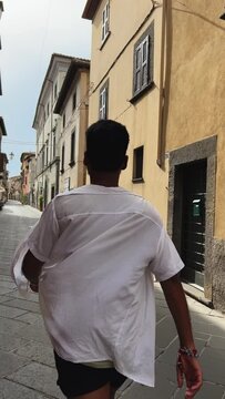person walking in the streets of italy