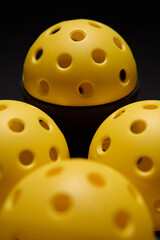 Set of specialized plastic balls with perforation for pickleball game