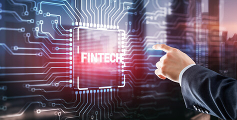 Tapping on the inscription Fintech financial technology digital money internet banking concept