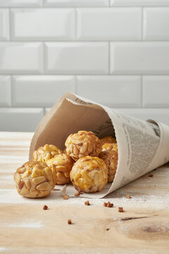 Panellets in newsprint cone